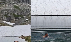 Artvin’de yaz ortasında karla kaplı göle girdiler